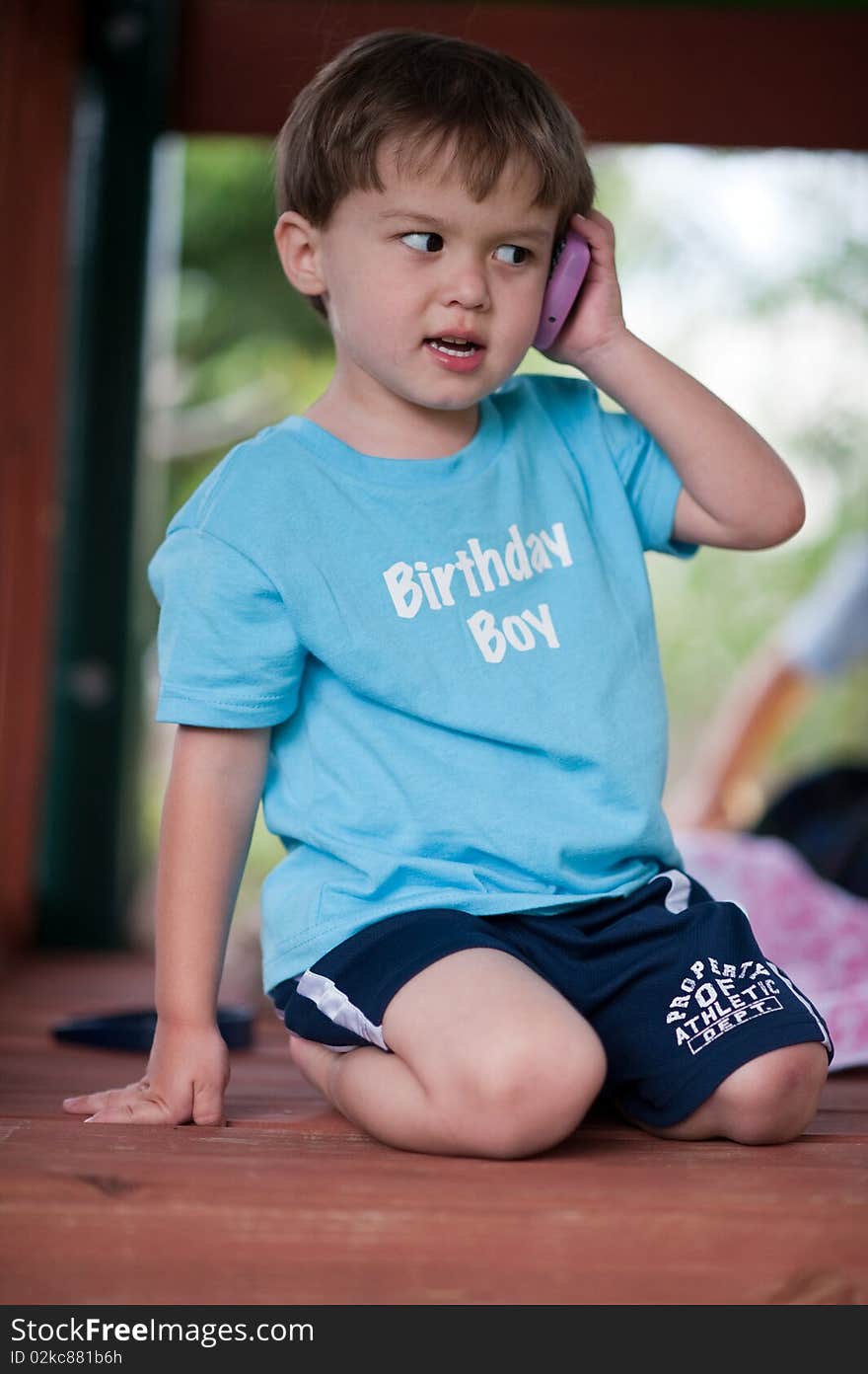 My son Luke talking on the phone on his birthday. My son Luke talking on the phone on his birthday.