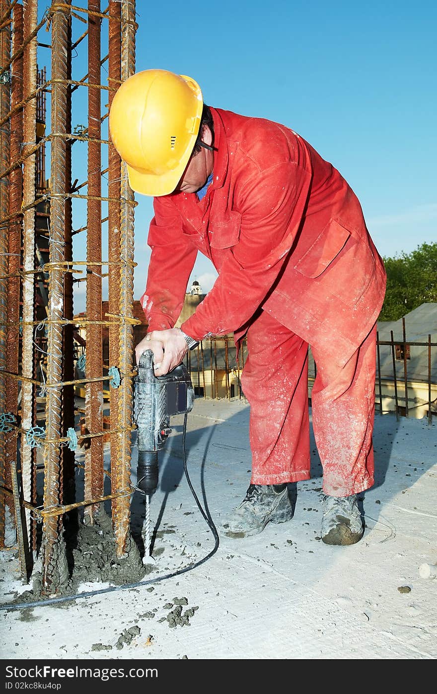 Construction worker builder during formwork installation for concrete filling. Construction worker builder during formwork installation for concrete filling