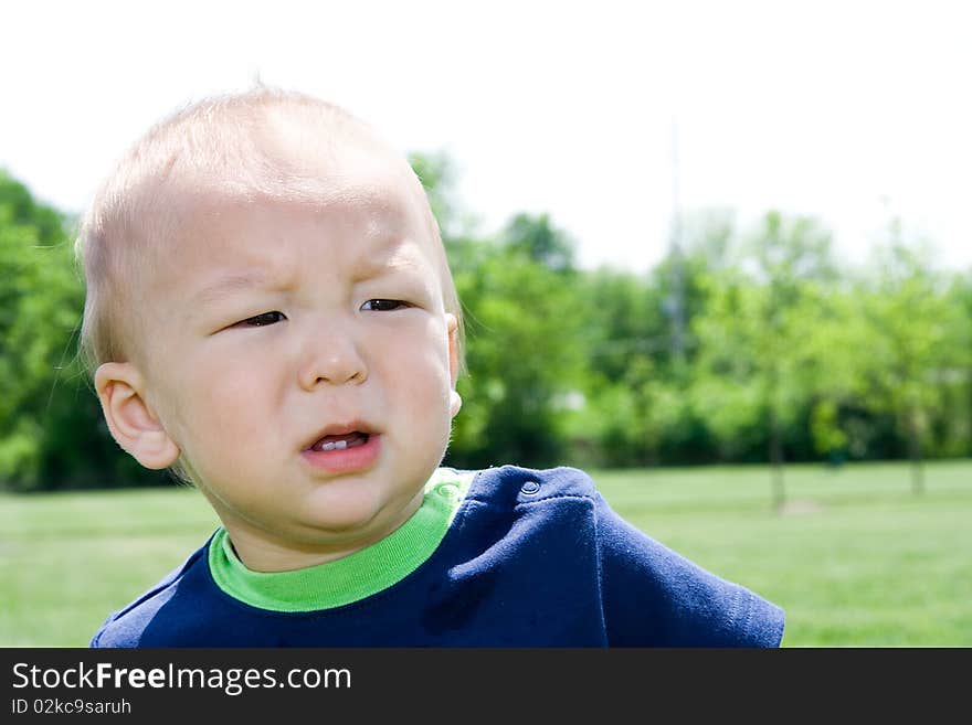 Unhappy Asian American multiethnic boy about to throw a tantrum or looking confused. Unhappy Asian American multiethnic boy about to throw a tantrum or looking confused.