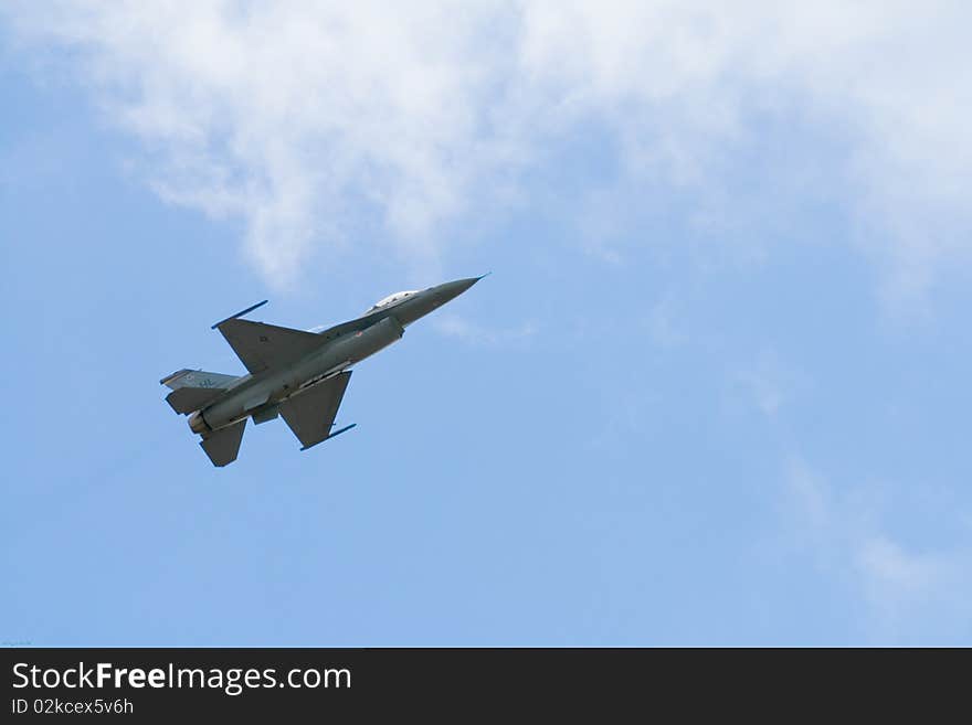 An F-16 fighter jet flying into the cloud at 2009 MCAS Miramar Airshow. An F-16 fighter jet flying into the cloud at 2009 MCAS Miramar Airshow