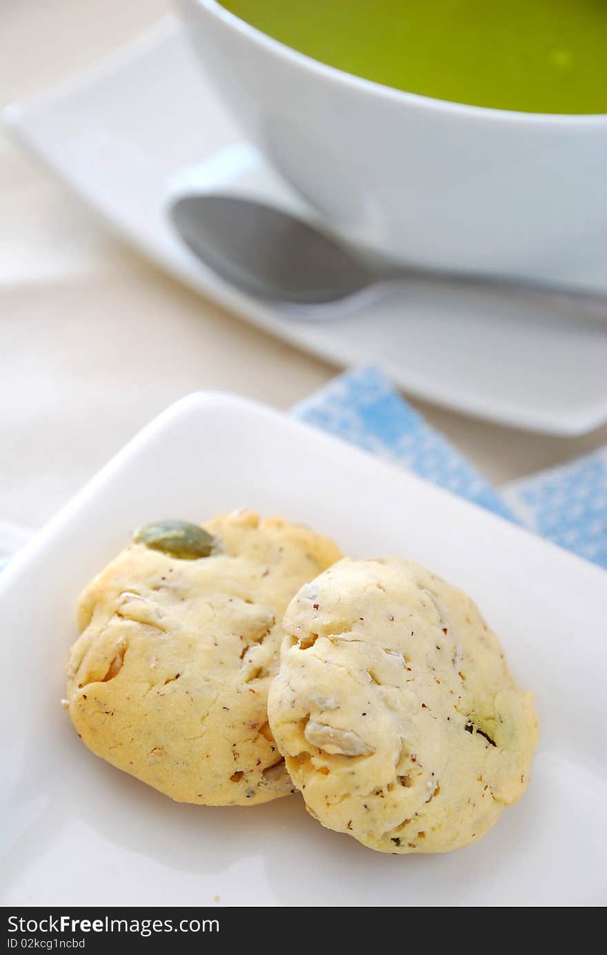 Healthy cookies on white plate with utensils. Filled with nutritious nuts for a healthy afternoon snack or high tea. Concepts such as food and beverage, diet and nutrition, and healthy lifestyle. Healthy cookies on white plate with utensils. Filled with nutritious nuts for a healthy afternoon snack or high tea. Concepts such as food and beverage, diet and nutrition, and healthy lifestyle.