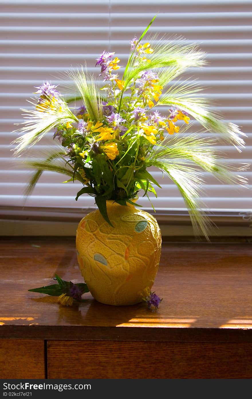 Beautiful bouquet of wild flowers in the background blinds