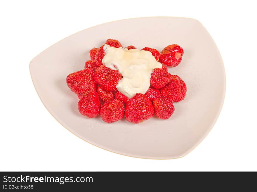 Strawberry with sugar and cream on a white plate. Strawberry with sugar and cream on a white plate