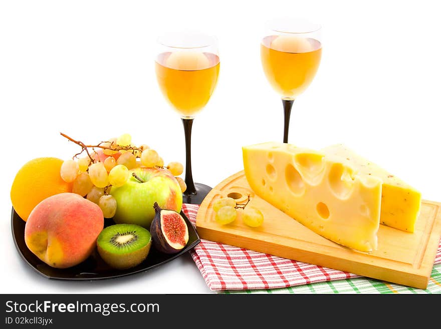 Wine, cheese and fruits isolated on white