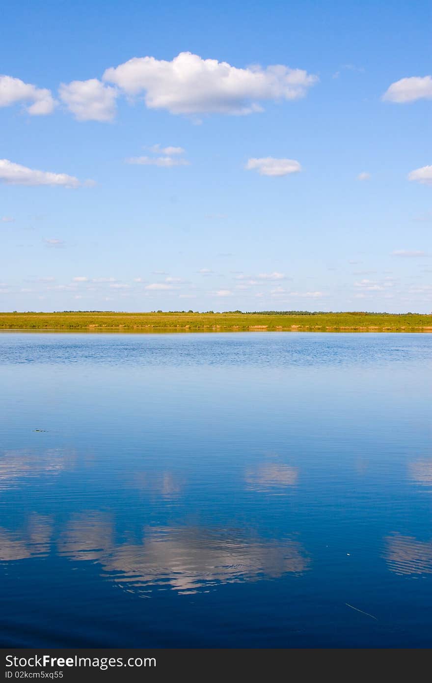 Beautiful river and yellow meadow