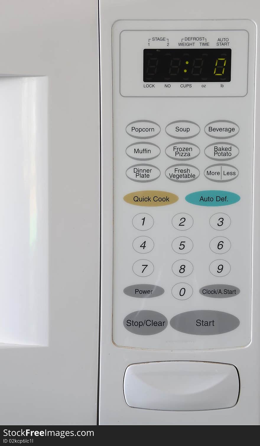 Closeup of a microwave and it's white buttons. Closeup of a microwave and it's white buttons