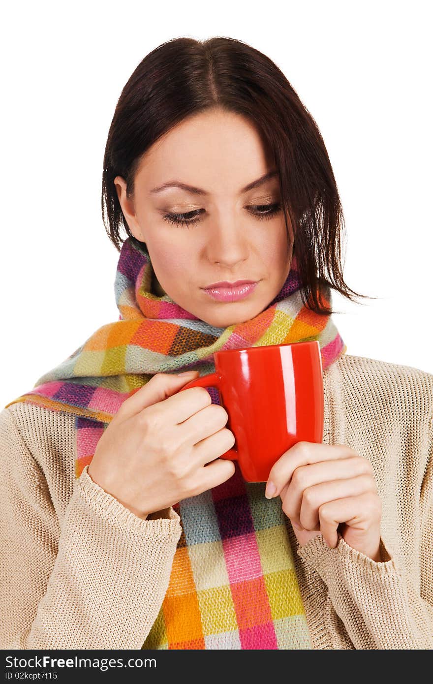 Yougn beautiful woman in warm scarf with a cup of tea. Yougn beautiful woman in warm scarf with a cup of tea