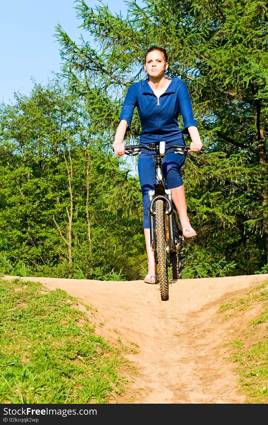 Pretty young woman on bicycle. Pretty young woman on bicycle