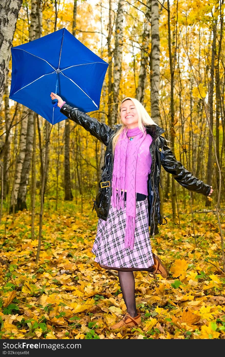 Pretty girl in autumn forest