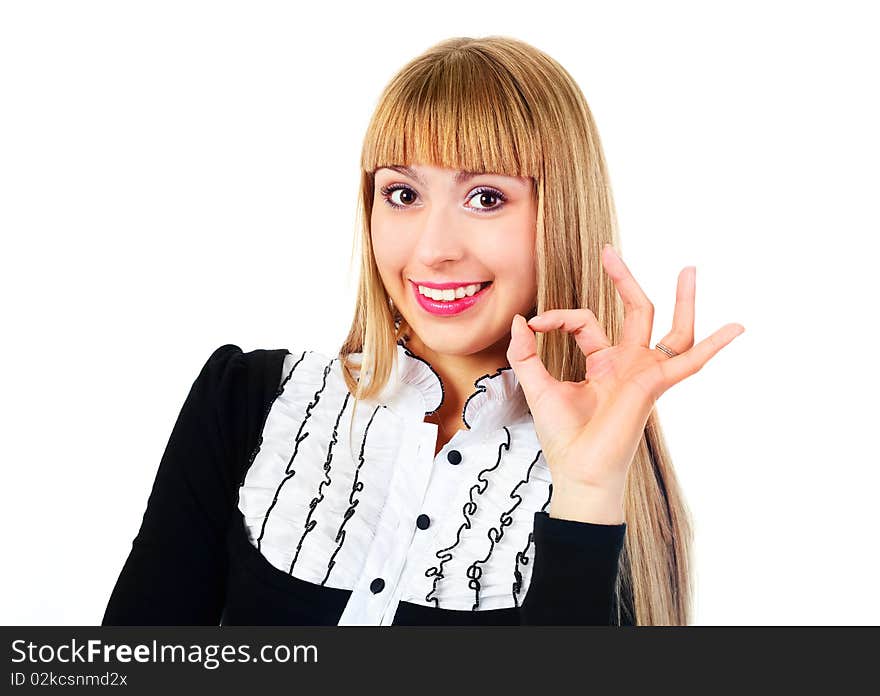 Beautiful young successful businesswoman showing the sign OK. Beautiful young successful businesswoman showing the sign OK