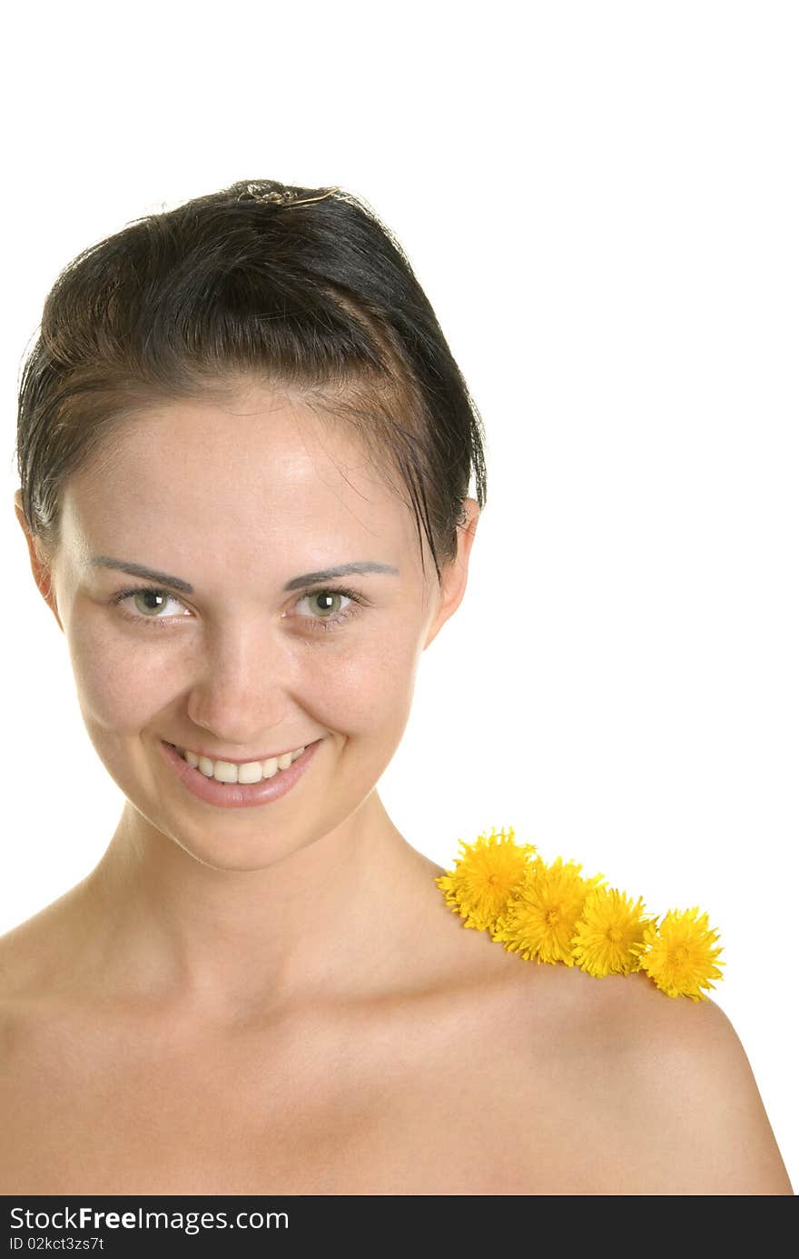 Three flowers on shoulder at smiling woman