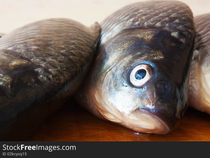 Fresh river fish on chopping board