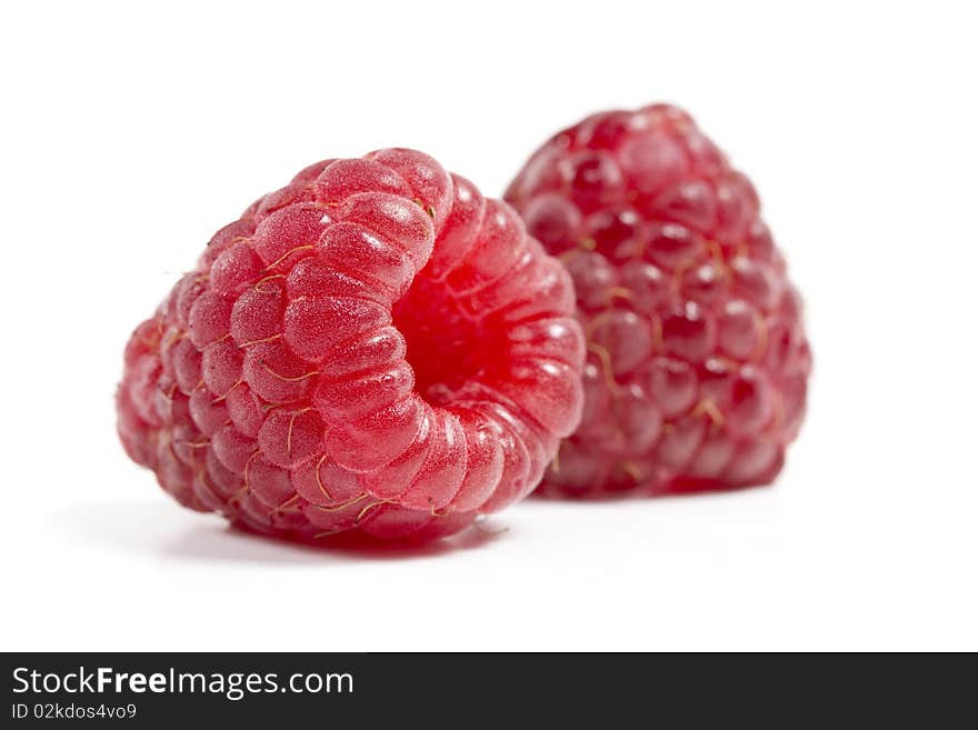 Ripe raspberries two pieces on a white background. Ripe raspberries two pieces on a white background