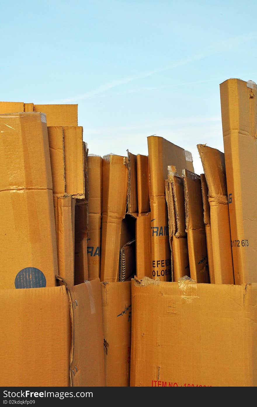 Few cardboard used and creased with a blue sky. Few cardboard used and creased with a blue sky