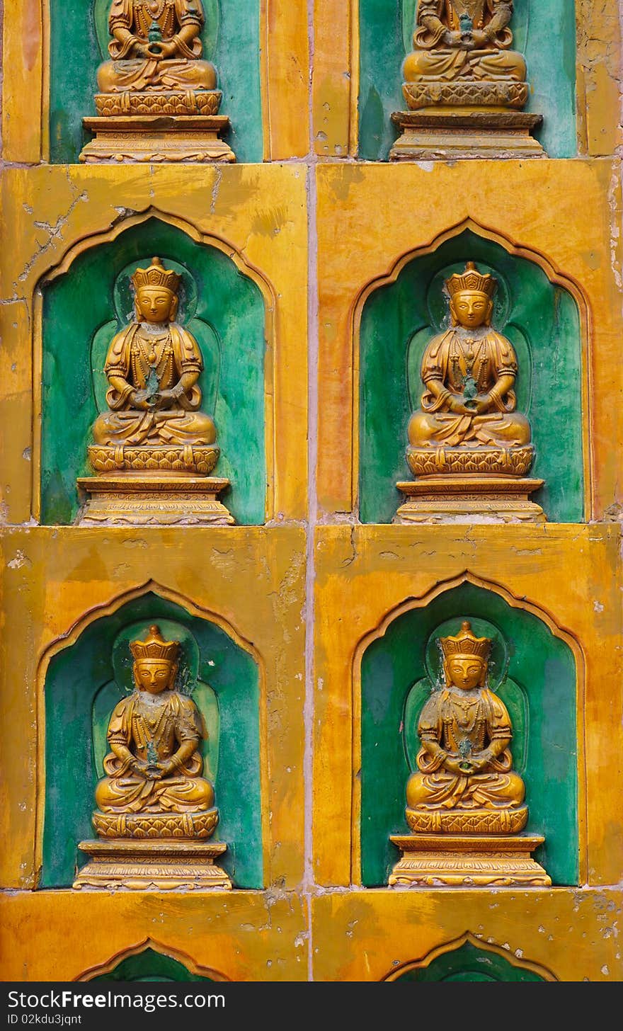 Relief sculpture of buddhas on the wall of a temple in Summer Palace, Beijing, China.