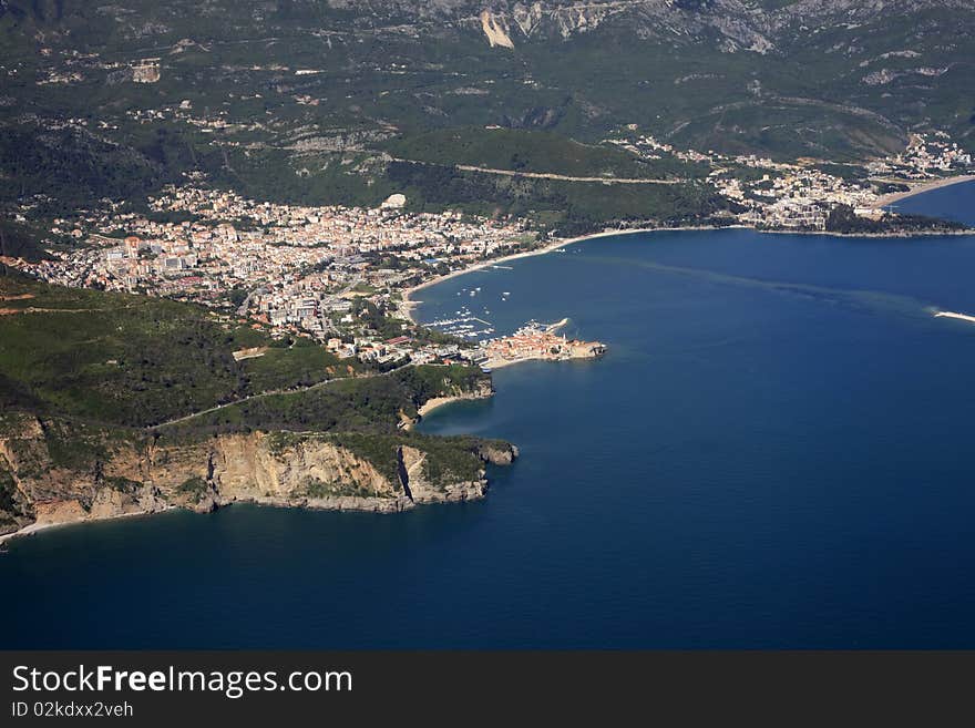 Kind at coast on Budva from an airplane from the height of bird flight. Montenegro. Kind at coast on Budva from an airplane from the height of bird flight. Montenegro