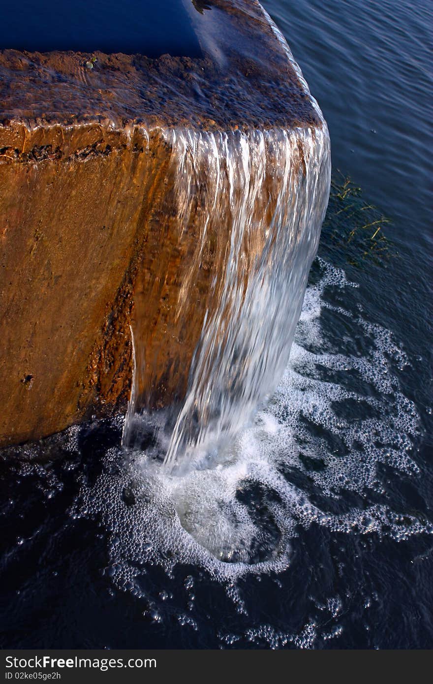 A curtain of water falling over a dam, wonderful!