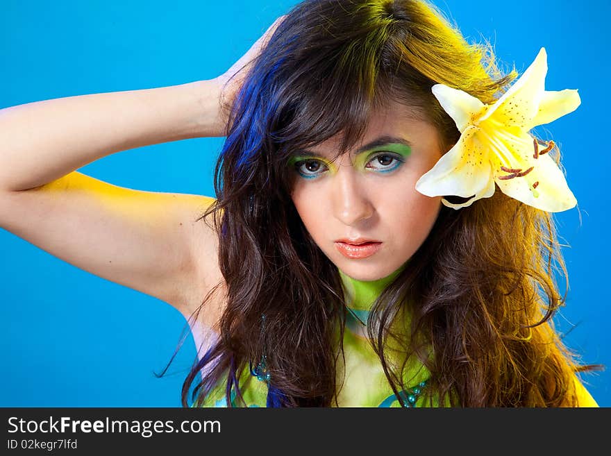 Young fashion model women over blue background