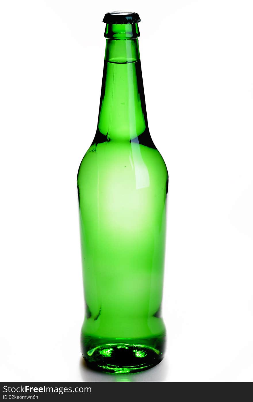 Green bottle with a drink isolated on white