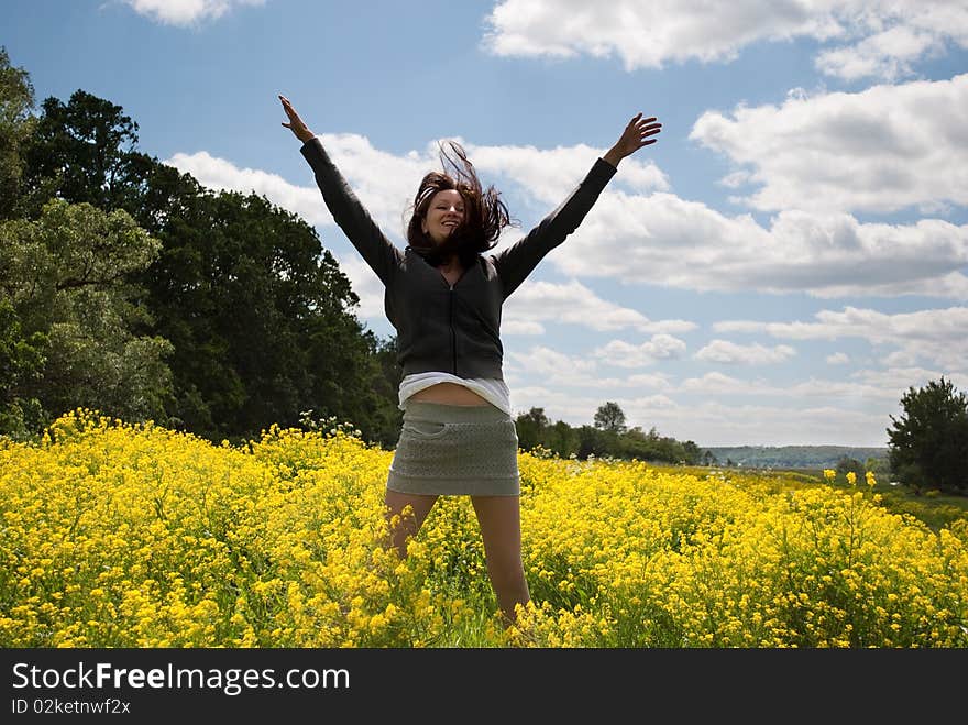 The girl and a field of camomiles. The girl and a field of camomiles