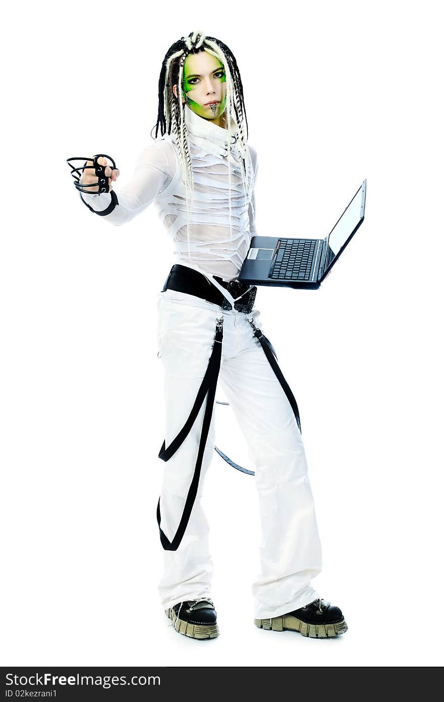 Shot of a futuristic young man with wires holding a laptop. Isolated over white background. Shot of a futuristic young man with wires holding a laptop. Isolated over white background.