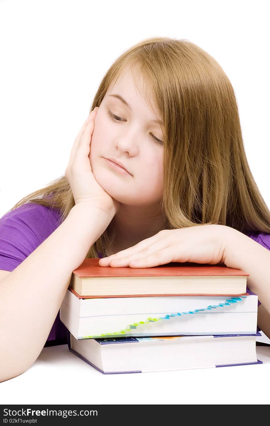 Unhappy young girl with books isolated. Unhappy young girl with books isolated