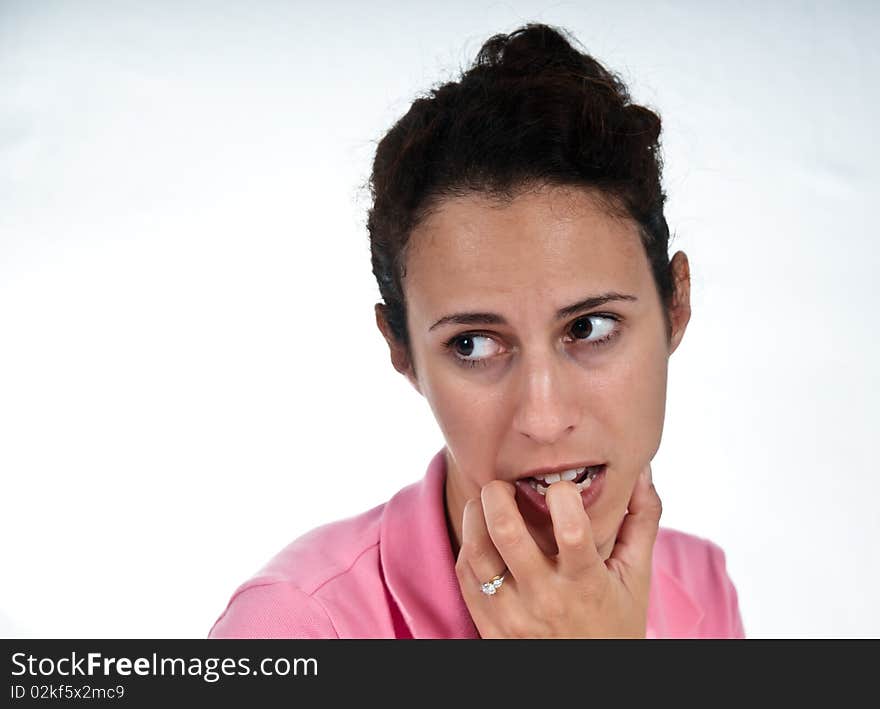 Concerned woman, biting her finger. Concerned woman, biting her finger