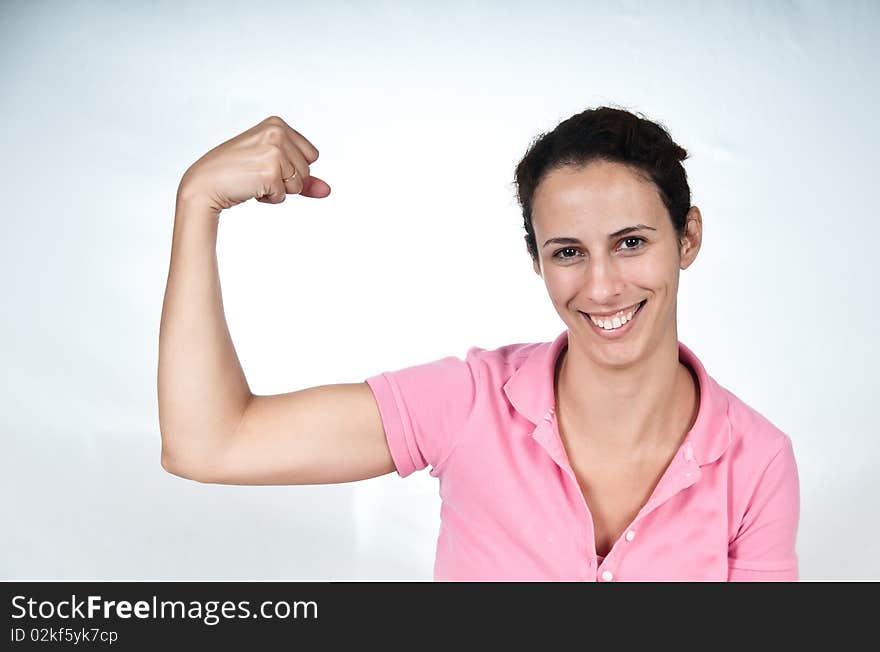 Smiling woman, flexing her bicep muscle. Smiling woman, flexing her bicep muscle