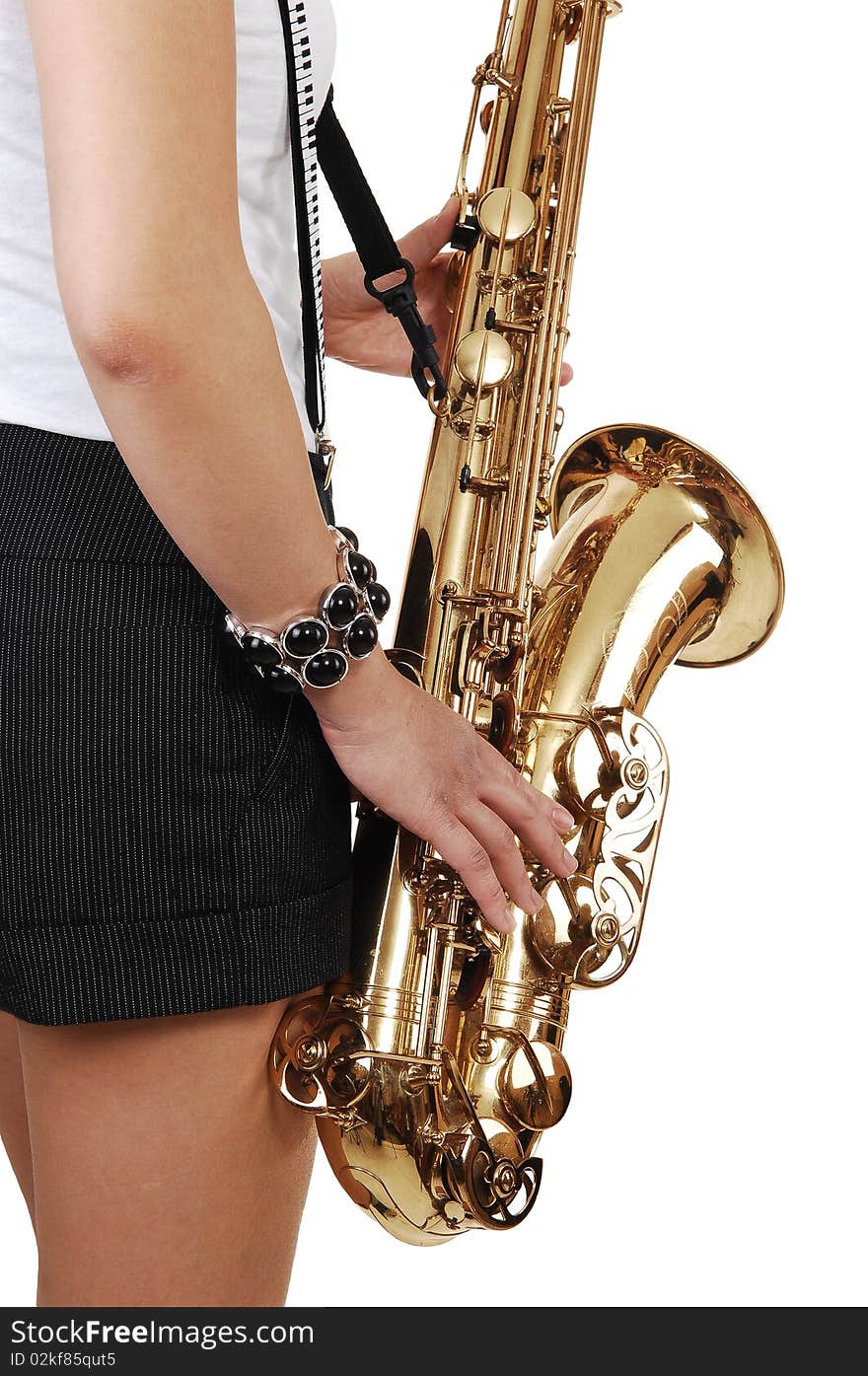 A young Asian woman standing in the studio, playing the saxophone in shorts with suspender, in closeup, for white background. A young Asian woman standing in the studio, playing the saxophone in shorts with suspender, in closeup, for white background.