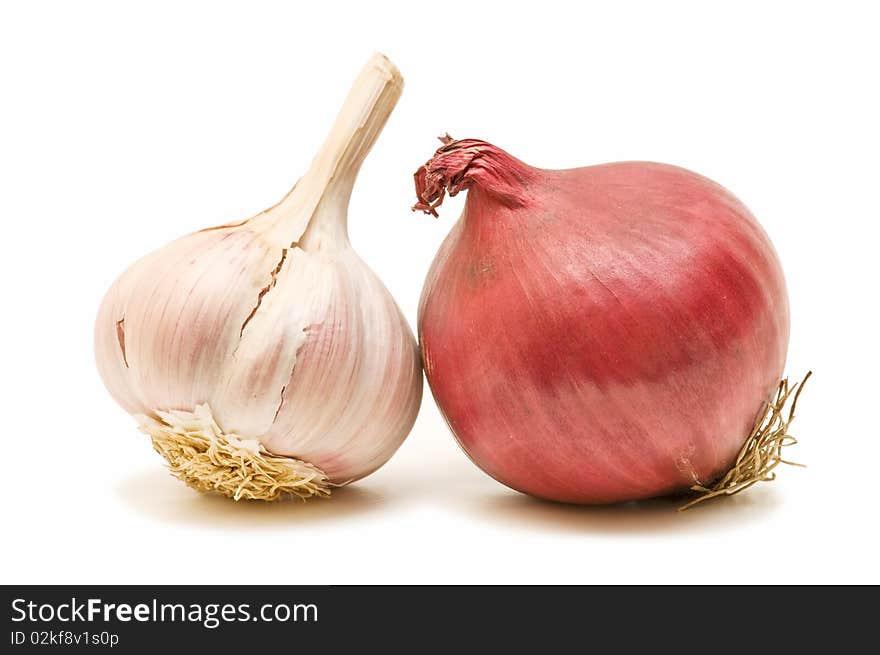 Fresh garlic and onion on white background