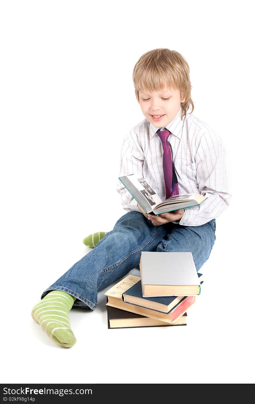 Young boy reading book isolated