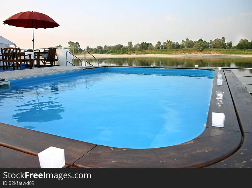 Swimming pool during cruise on a river. Swimming pool during cruise on a river