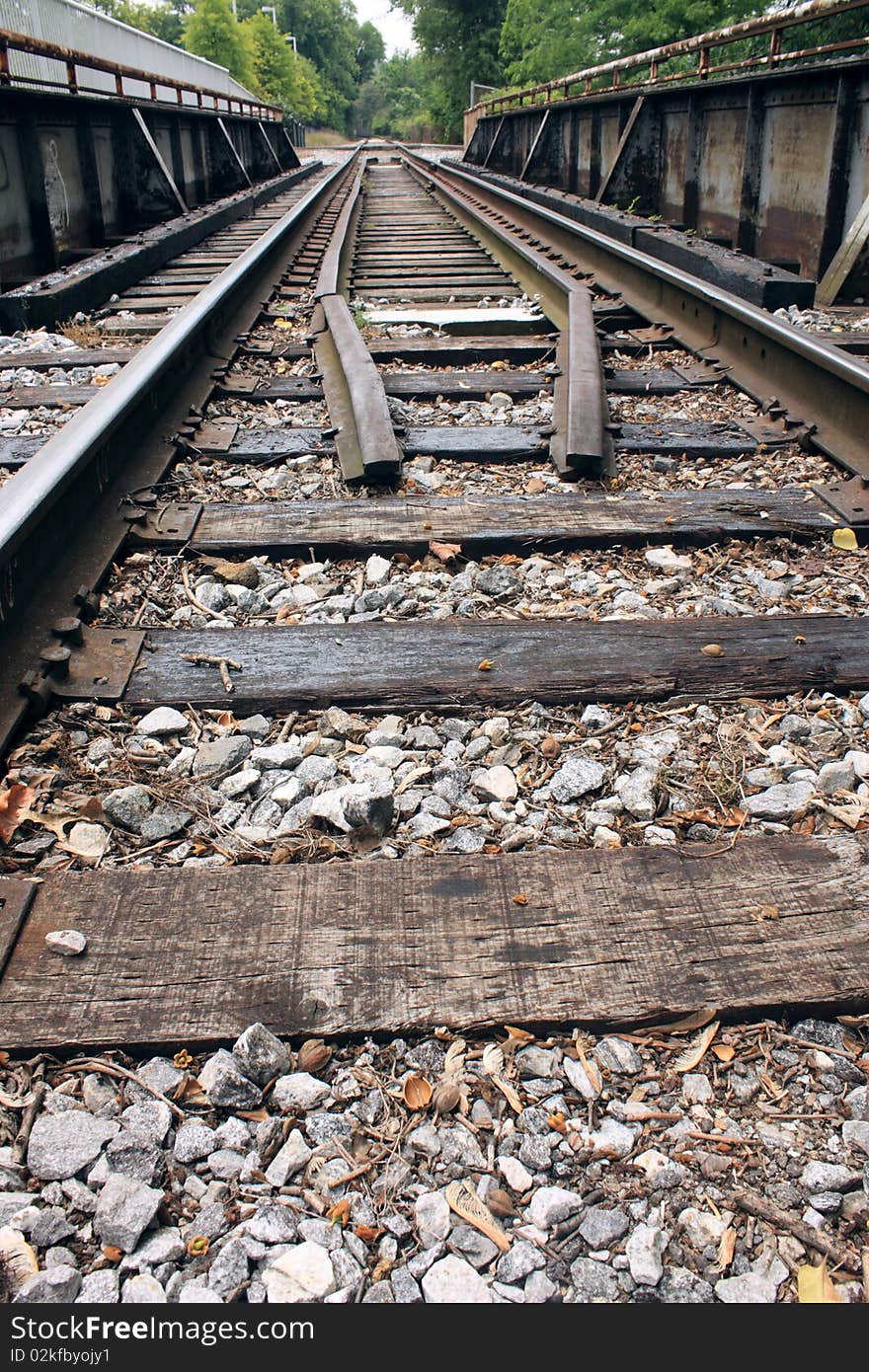 Low angle of railroad tracks crossing a small bridge. Low angle of railroad tracks crossing a small bridge.