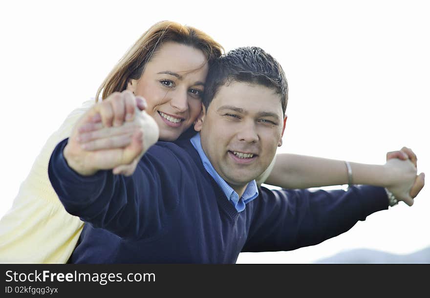 Happy young couple have good time and fun outdoor at beautiful sunny day. Happy young couple have good time and fun outdoor at beautiful sunny day