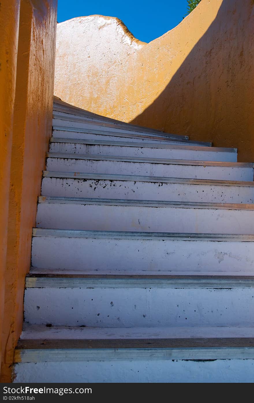 Staircase on orange building in the Bahamas