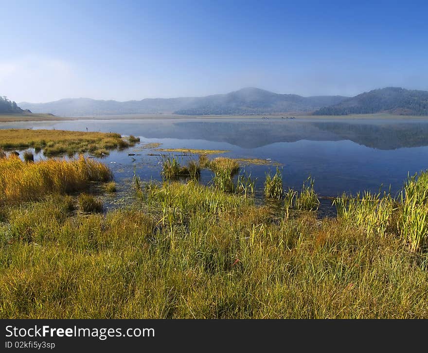 Mountain lake high in the mountains in the morning