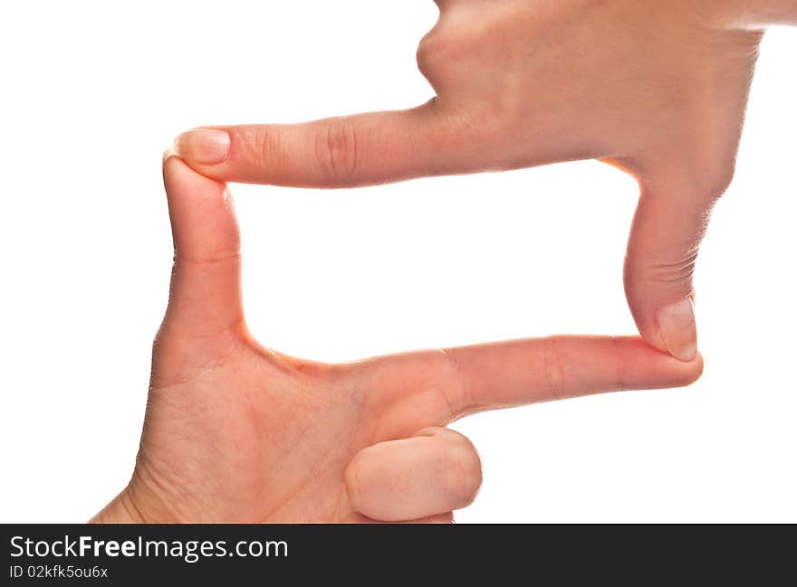 Female hands forming a frame. Isolated on a white background. Female hands forming a frame. Isolated on a white background.