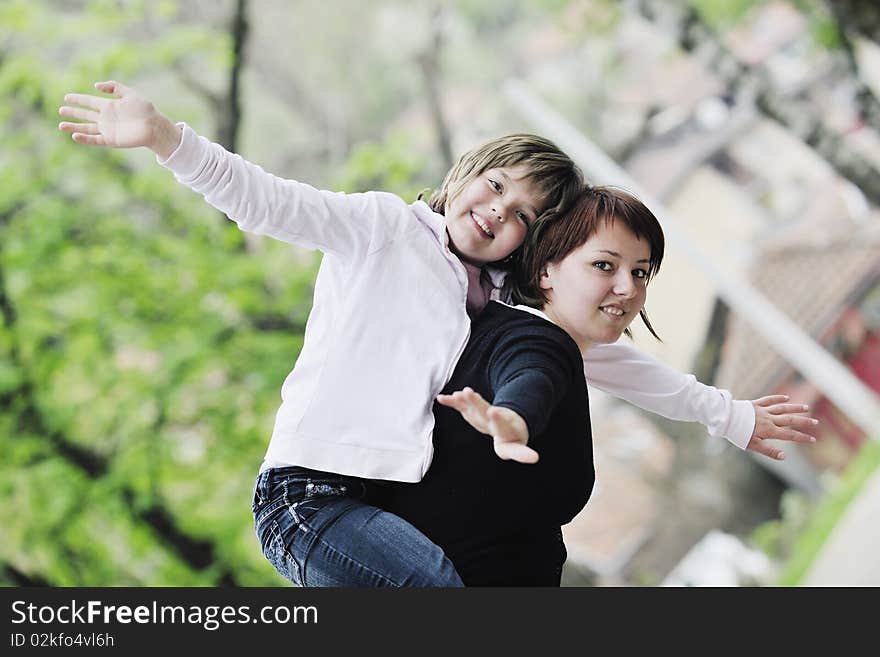 Happy young family outdoor mom and daughter play and have fun. Happy young family outdoor mom and daughter play and have fun