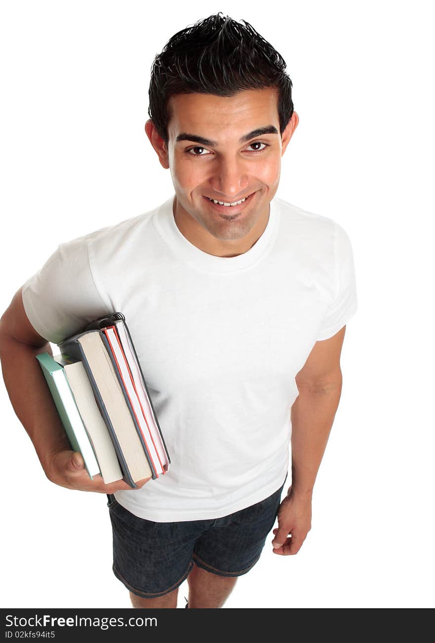 Happy male ethnic mixed race student looking up and smiling. He is carrying books under one arm. White background. Happy male ethnic mixed race student looking up and smiling. He is carrying books under one arm. White background.