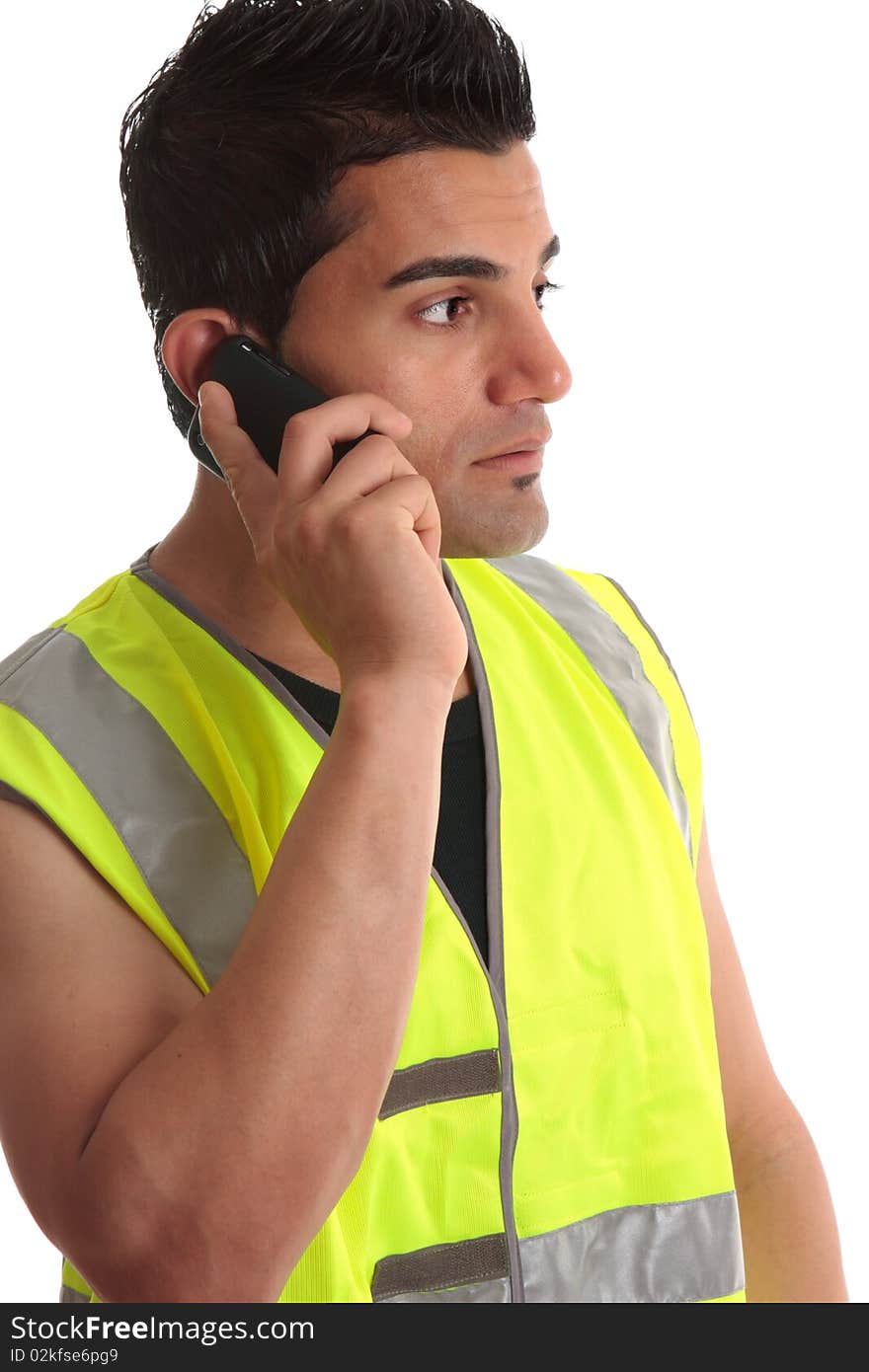 Tradesman on phone looking sideways