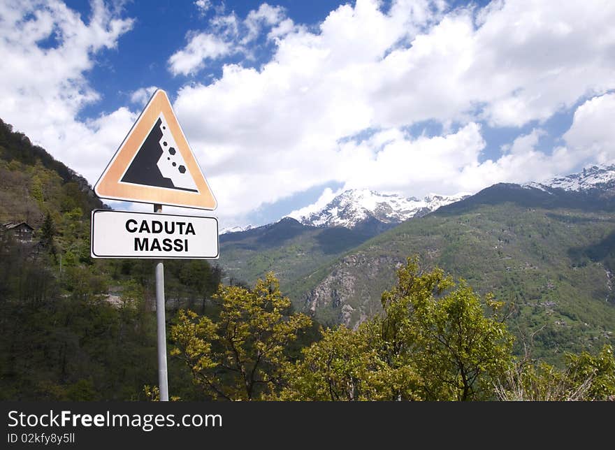 Picture of apline landscape with signal of falling rocks. Picture of apline landscape with signal of falling rocks