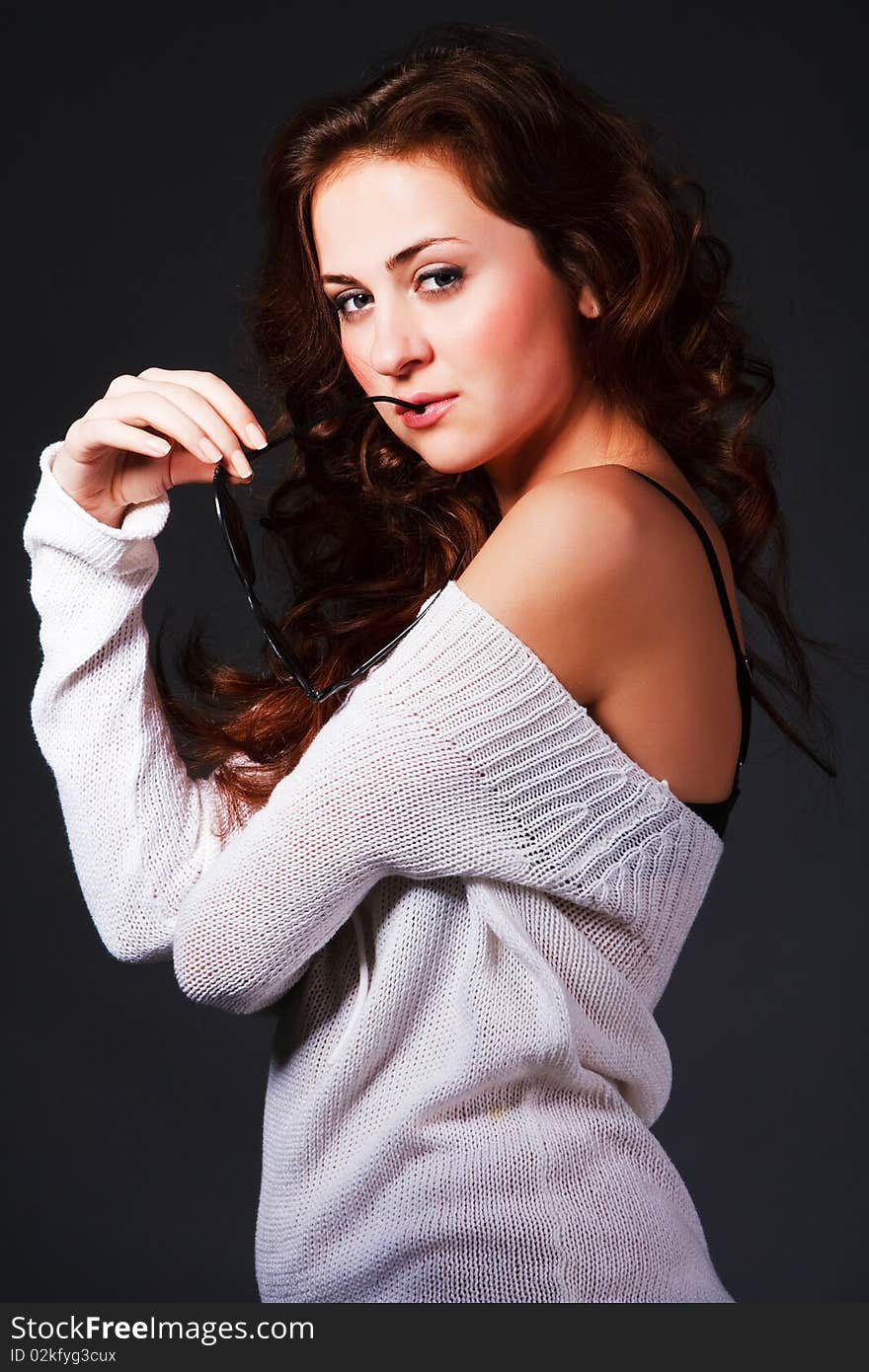 Portrait of a attractive young girl in sunglasses on grey background. Portrait of a attractive young girl in sunglasses on grey background.