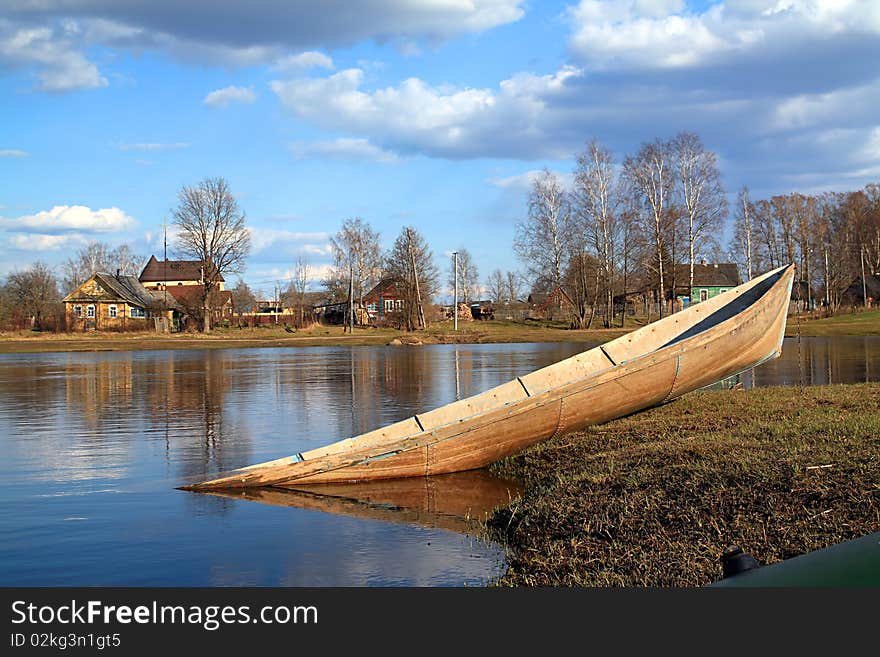 Against village boat in water