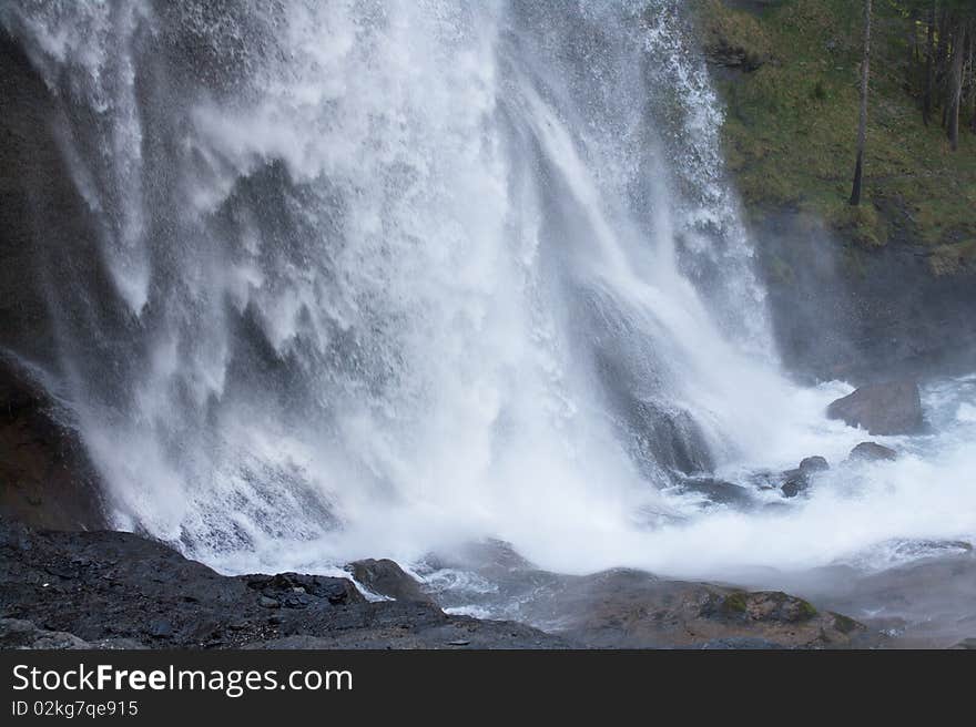 Waterfall dumping to stones, tons of water. Waterfall dumping to stones, tons of water