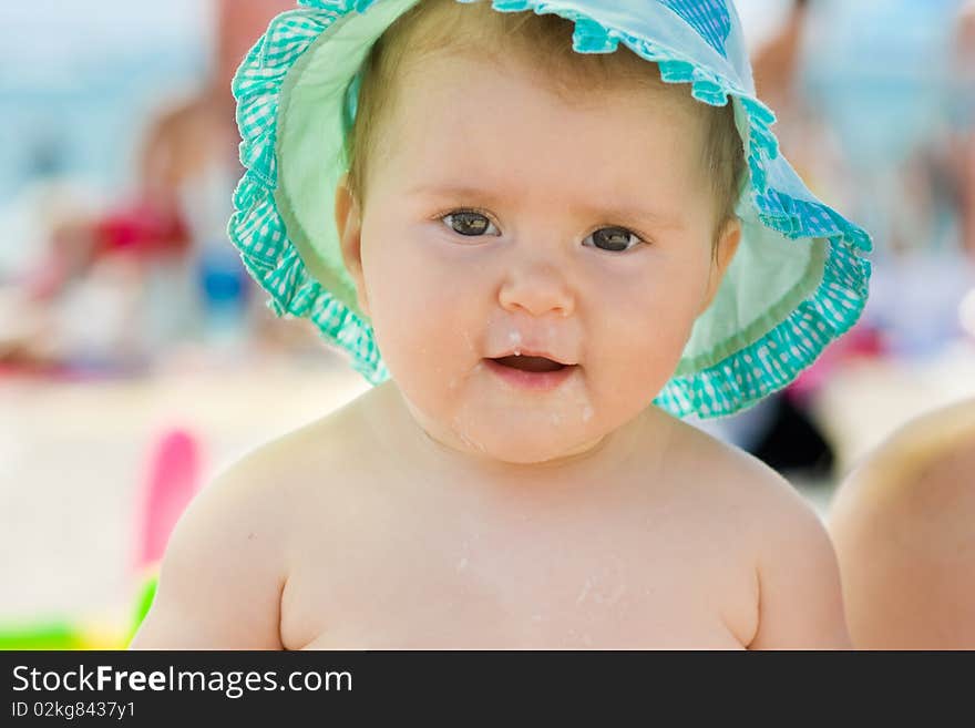 Happy baby with food all over the face.