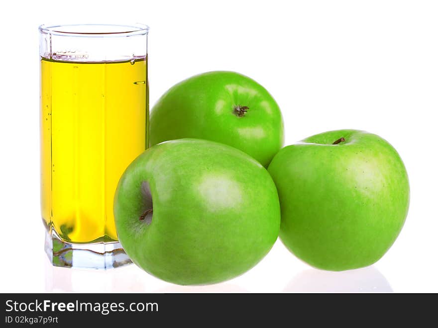 Glass of apple juice with apples isolated on white background