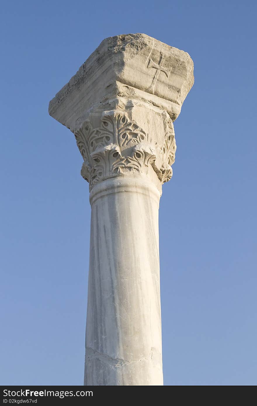 Old classical column over clear blue sky. Old classical column over clear blue sky