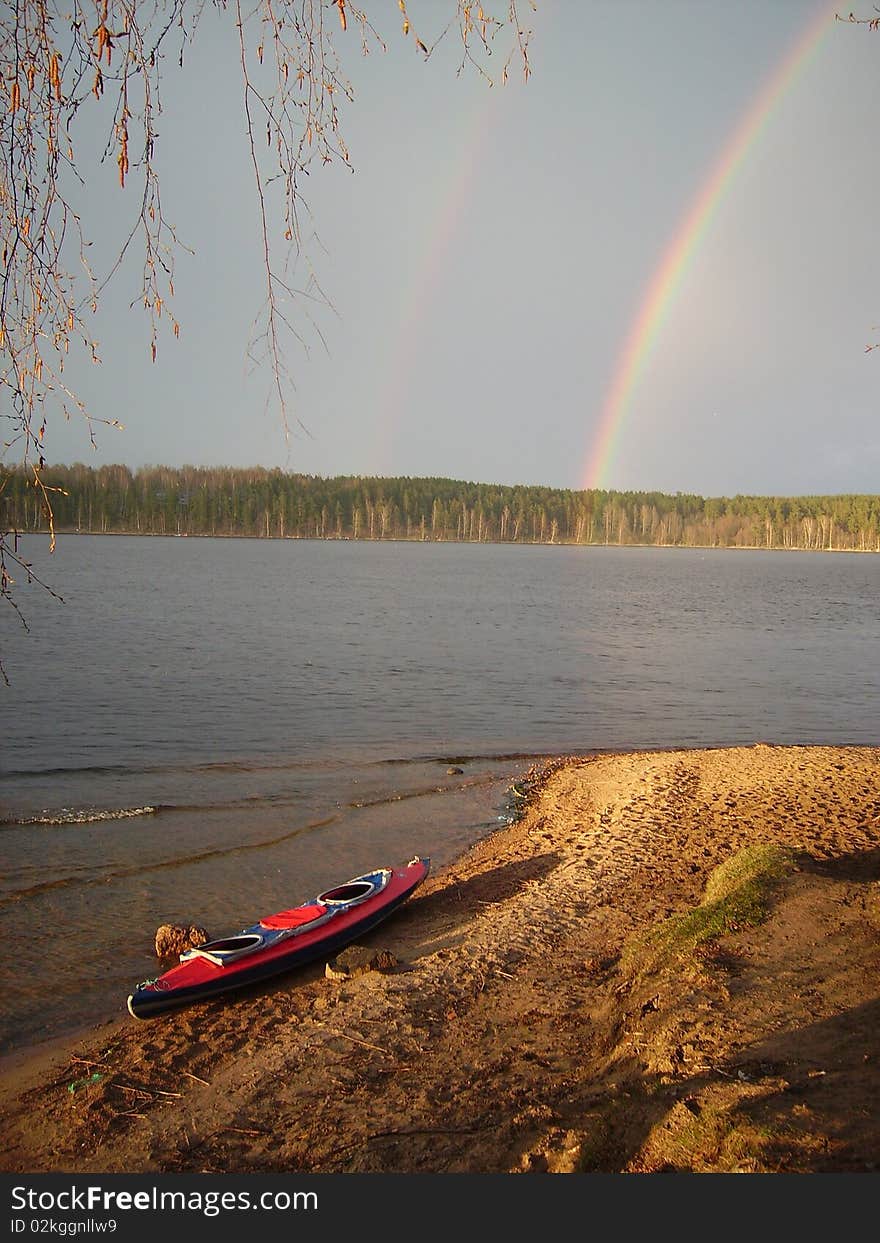 Kayak Travel Under Double Rainbow