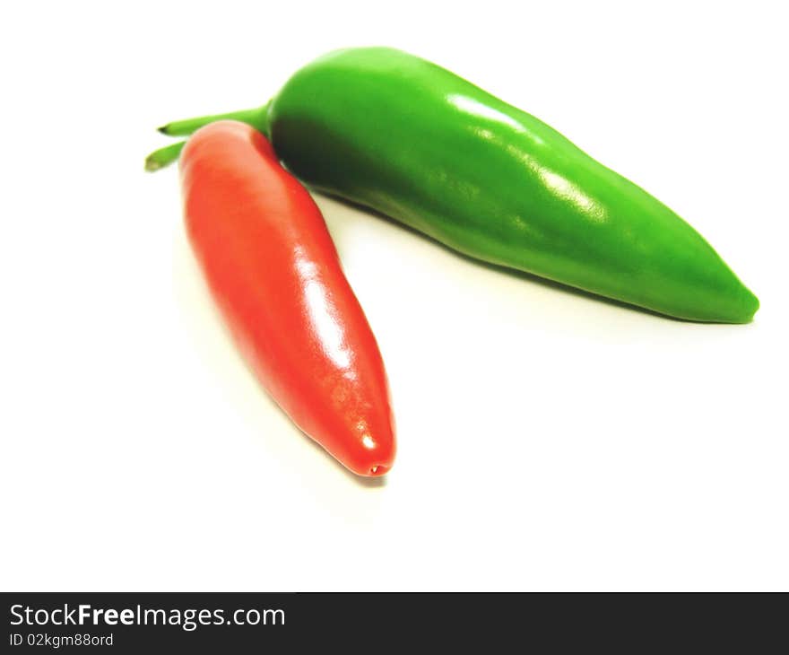 Green and red pepper closeup isolated shot. Green and red pepper closeup isolated shot