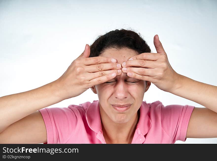 Woman in pain, squeezing forehead with her fingers. Woman in pain, squeezing forehead with her fingers